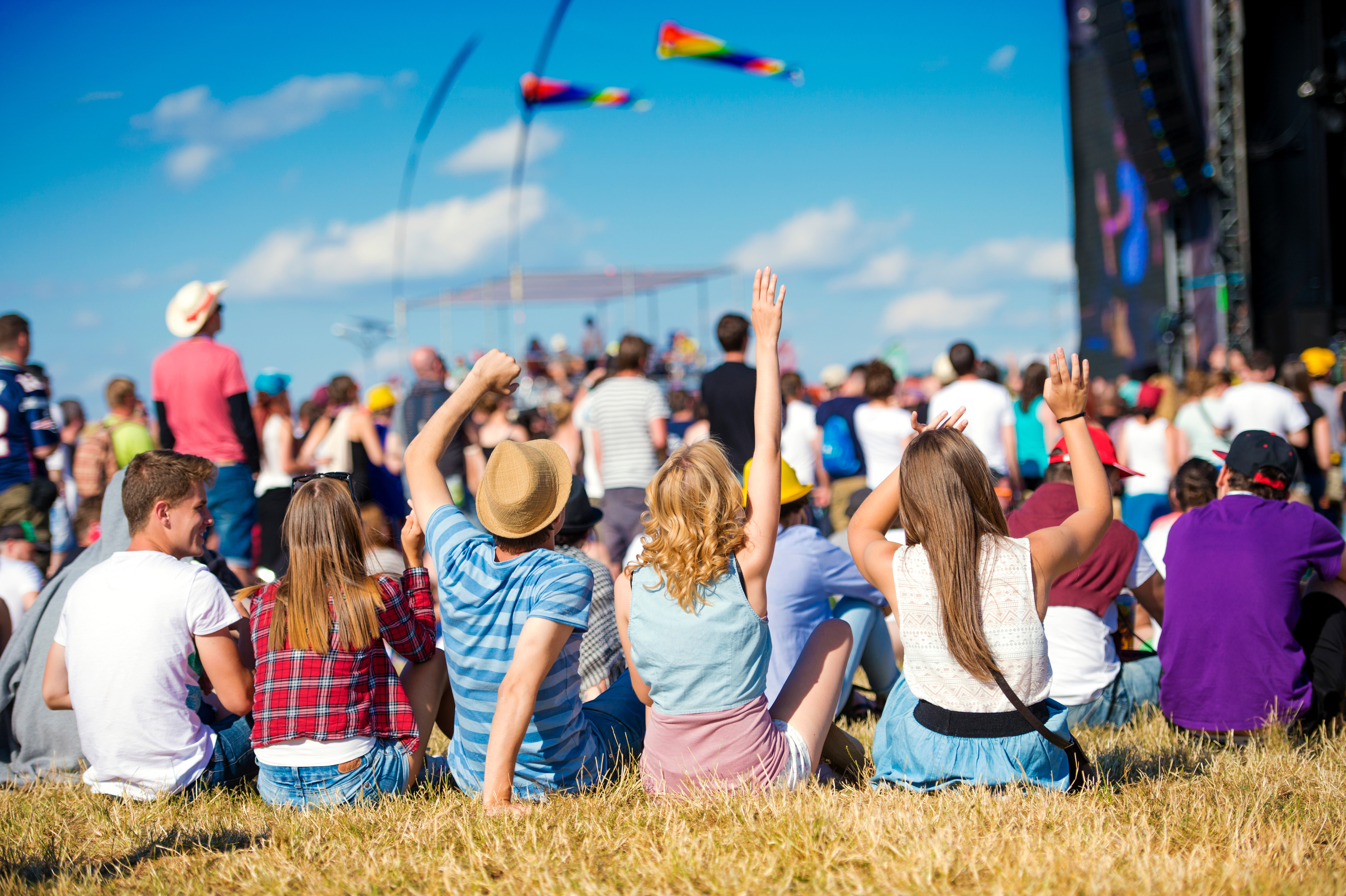 Crowd under a blue festival sky